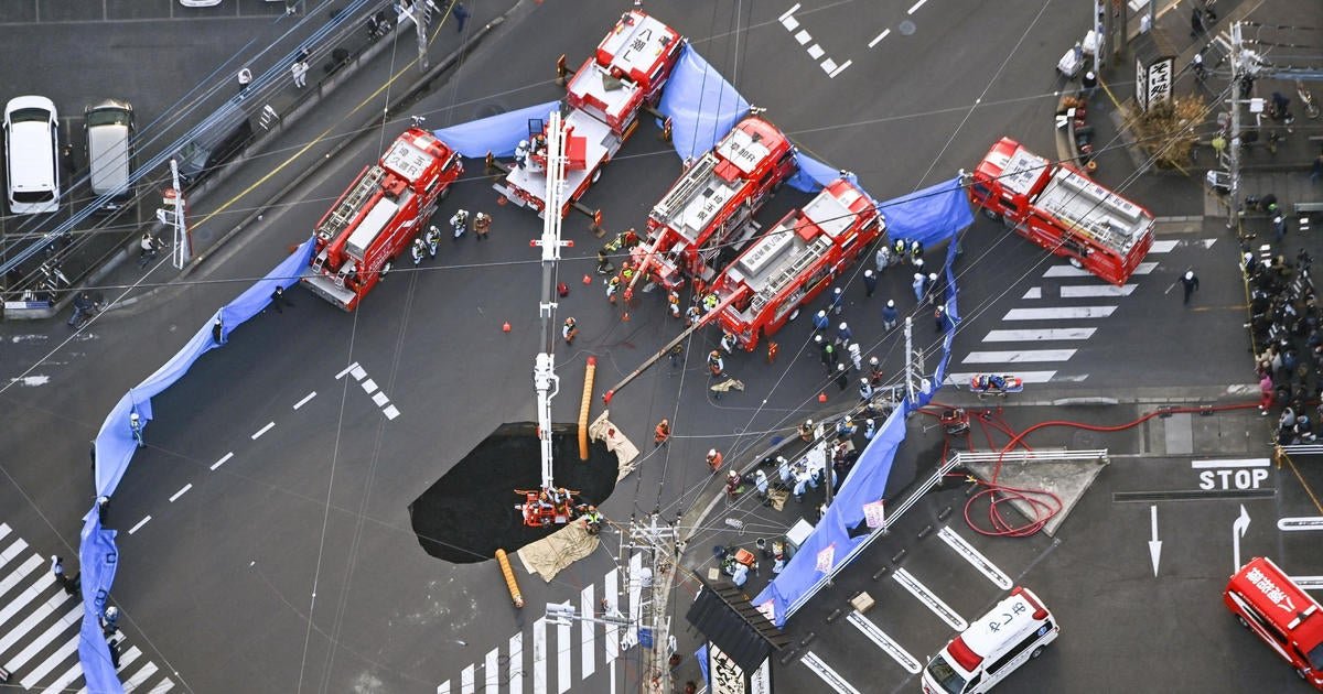 Driver still stuck in large sinkhole in Japan over 24 hours after truck plunged inside; nearby residents evacuated