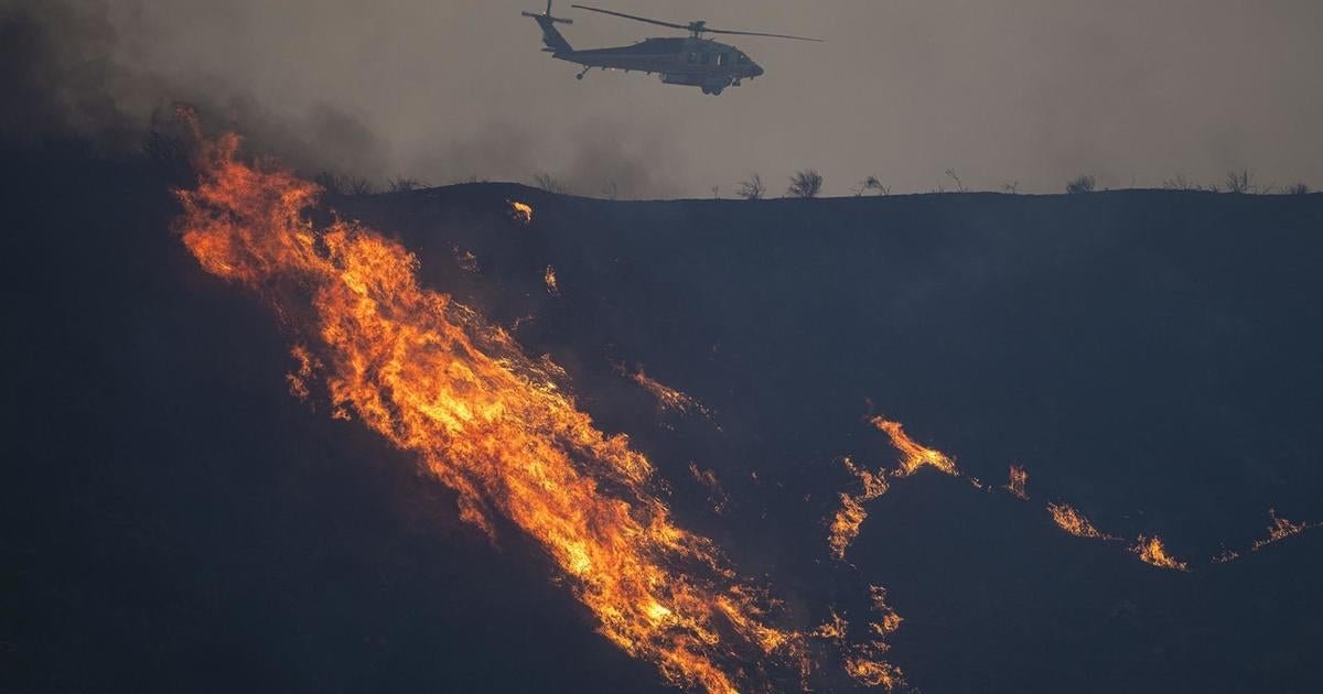 Crews around Los Angeles battling new wildfires, Trump threatening to withhold aid