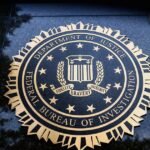 Longtime FBI agent charged with disclosing confidential records